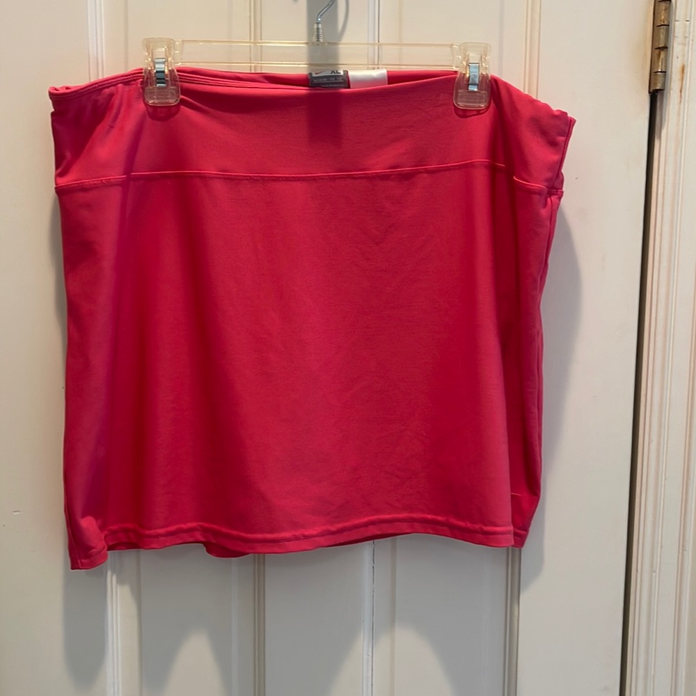 Nike pink tennis skirt with built in shorts. 16 inches in length.